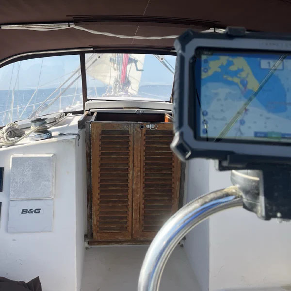 The companionway is the best way to stay under cover in the rain without going below